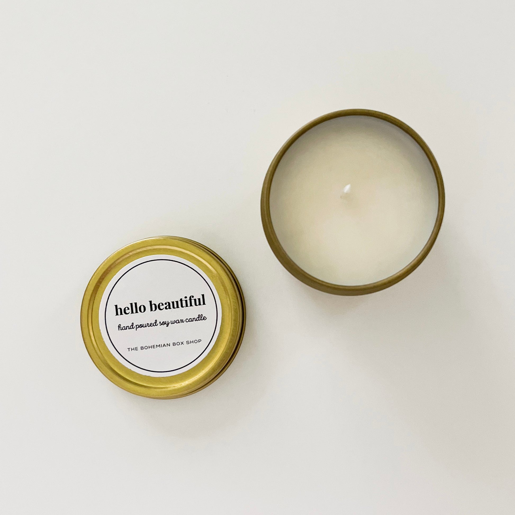 Hello beautiful 2 ounce soy candle tin in the color gold. 